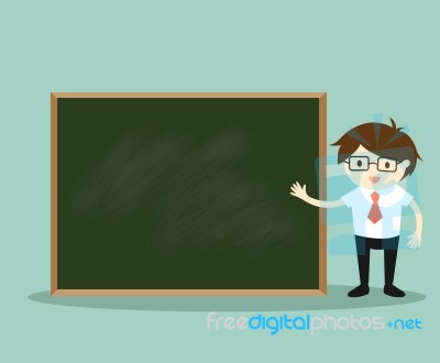 Business Concept, Businessman Standing In Front Of Green Chalkboard For Presentation Stock Image