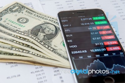 Business Concept. Financial Analysis, Smaetphone And Us Dollars Money Stock Photo