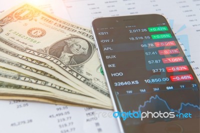 Business Concept. Financial Analysis, Smaetphone And Us Dollars Money Stock Photo