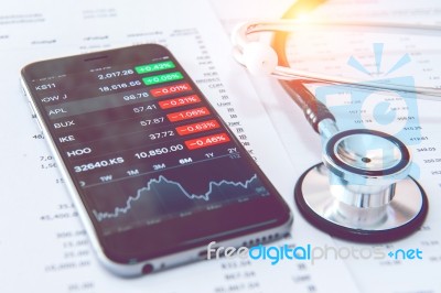 Business Concept. Financial Analysis, Smartphone And Stethoscope… Stock Photo