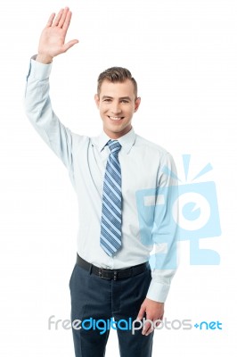 Business Execuitve Raising His Hand Stock Photo