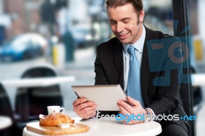 Business Executive At Open Restaurant Stock Photo