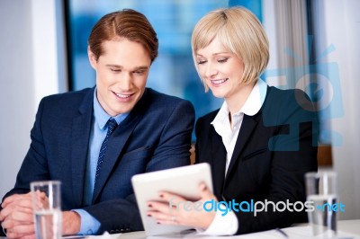 Business Executives Discussing At Office Stock Photo