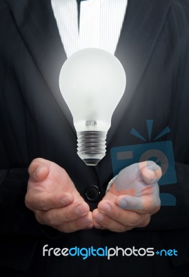 Business Hand Holding Light Bulb Stock Photo