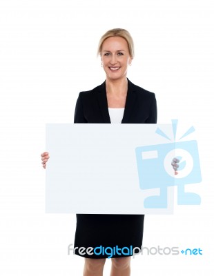 Business Lady Displaying Blank White Ad Board Stock Photo