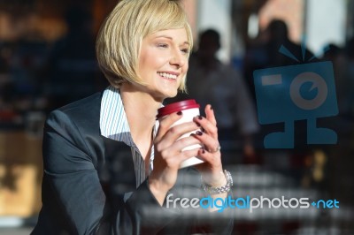 Business Lady Enjoying Her Refreshment Stock Photo