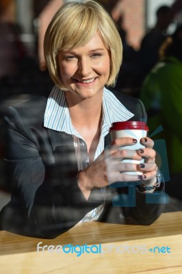 Business Lady Enjoying Her Refreshment Stock Photo