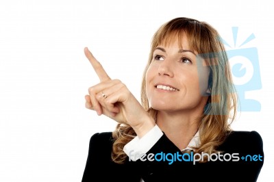 Business Lady Pointing At Something Stock Photo