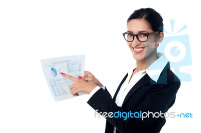 Business Lady Pointing Out Profits Graph On Report Stock Photo