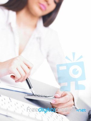 Business Lady Using Calculator Stock Photo