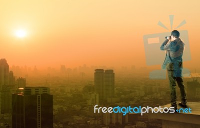 Business Man And Binocular Spying Acting Standing On Top Of Offi… Stock Photo