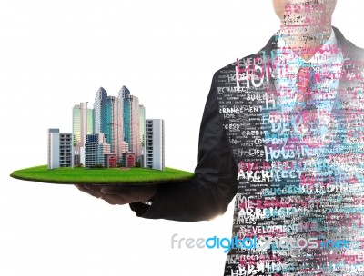 Business Man And Real Estate In Hand Stock Photo