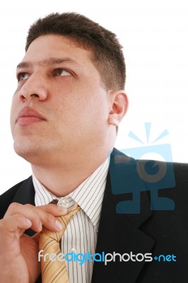 Business Man Fixing His Tie Stock Photo