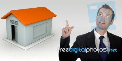 Business Man Gesturing With Hand And Three Dimensional House Stock Photo