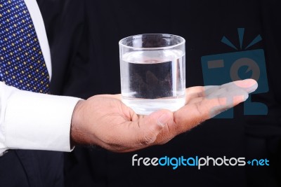 Business Man Holding A Glass Of Water Stock Photo