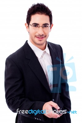 Business Man Holding A Mobile Phone Stock Photo