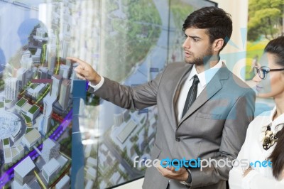 Business Man Holding A Presentation Stock Photo