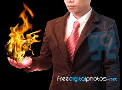 Business Man Holding Fire Flaming On Hand Stock Photo