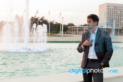 Business Man In Front Of A Fountain Stock Photo