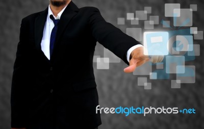 Business Man Pushing On A Touch Screen Interface Stock Photo