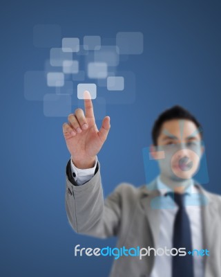 Business Man Pushing On A Touch Screen Interface Stock Photo