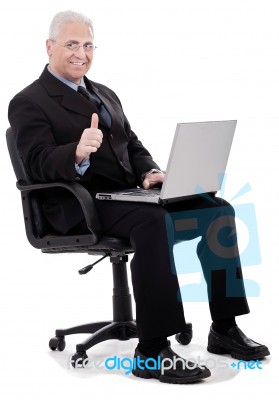 Business Man Shows Thumbs Up Stock Photo