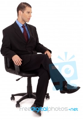 Business Man Sitting In Chair Stock Photo