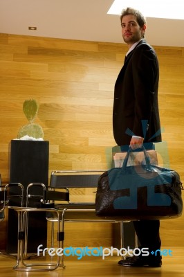 Business Man Standing In Lobby Stock Photo