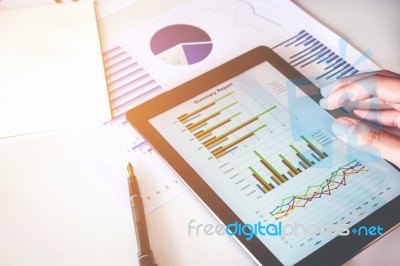 Business Man Using Digital Tablet With Report Chart Stock Photo