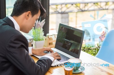 Business Man Using Portable Laptop Computer While Sitting In The… Stock Photo