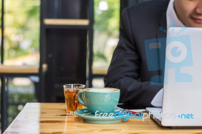 Business Man Using Portable Laptop Computer While Sitting In The… Stock Photo