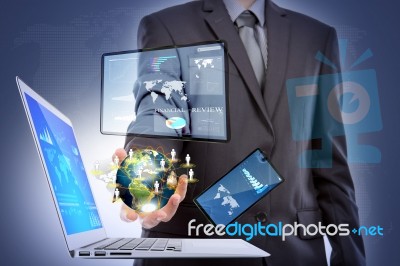 Business Man With Laptop,mobile Phone,touch Screen Device Stock Photo