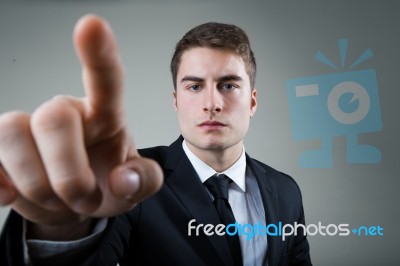 Business Man With Pointing To Something Or Touching A Screen Stock Photo