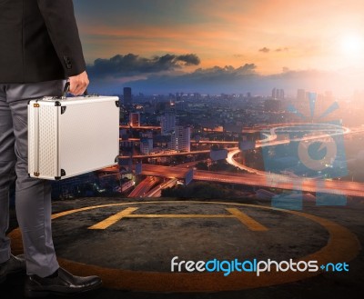 Business Man With Strong Metal Breifcase Standing On Helicopter Stock Photo