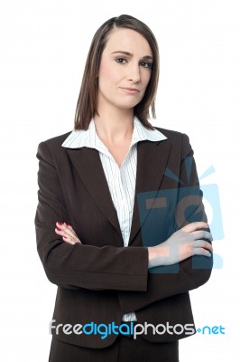 Business Manager Posing With Her Arms Crossed Stock Photo