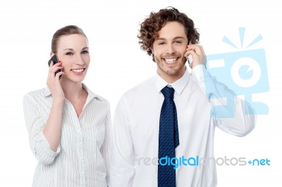 Business People Communicating Thru Mobile Phone Stock Photo