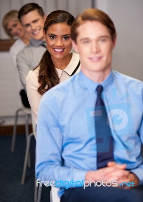 Business People Sitting In A Row Stock Photo