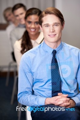 Business People Sitting In Meeting Room Stock Photo