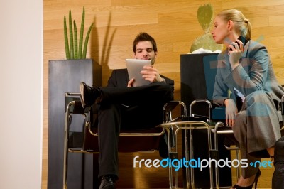 Business People With Phone And Ipad Stock Photo