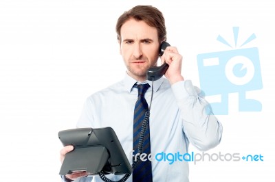 Business Professional Attending Call Stock Photo