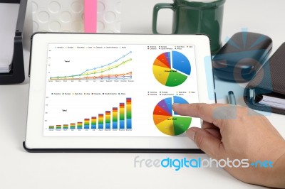 Business Report Show On Tablet Stock Photo