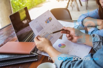 Business Team Working On Laptop, While Sitting At Office. Business People Stock Photo