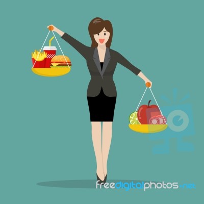 Business Woman Balancing Junk Food And Healthy Food On Two Weigh… Stock Image