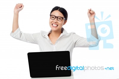 Business Woman Clenching Fists In Excitement Stock Photo