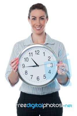 Business Woman Holding Wall Clock Stock Photo