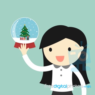 Business Woman Is Holding Snow Globe With A Christmas Tree Inside Stock Image