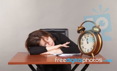 Business Woman Sleeping At The Table Stock Photo