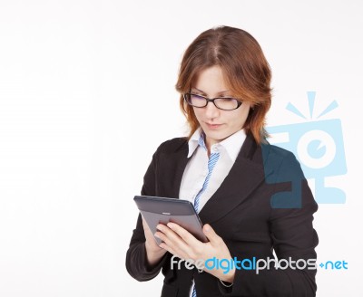 Business Woman With Glasses Looking At The Tablet Display Stock Photo