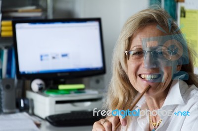 Business Woman Working In His Office Stock Photo