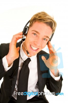 Businessman Adjusting Headset Stock Photo